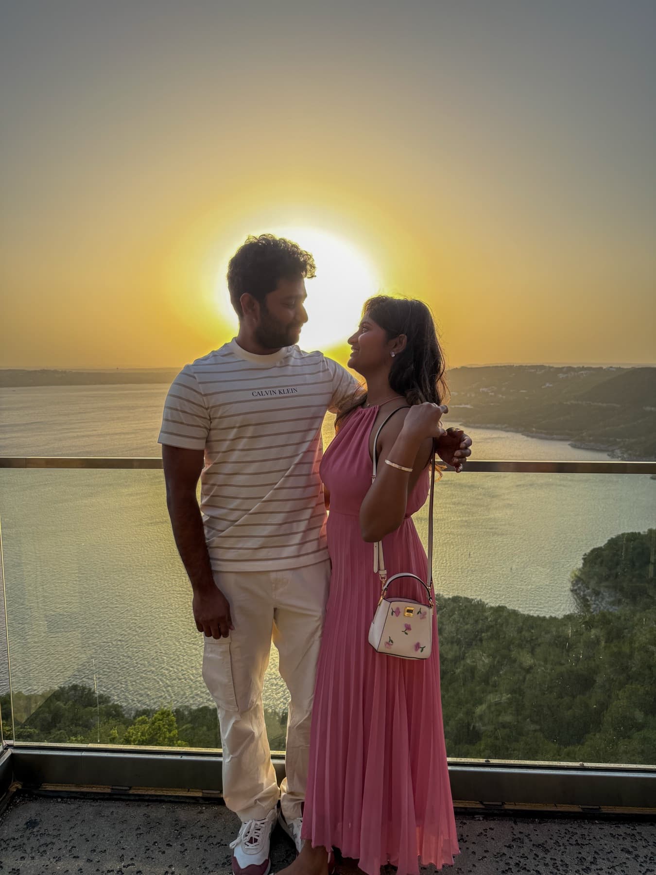 Tejesh & Madhu Padisetti at a golden sunset overlook