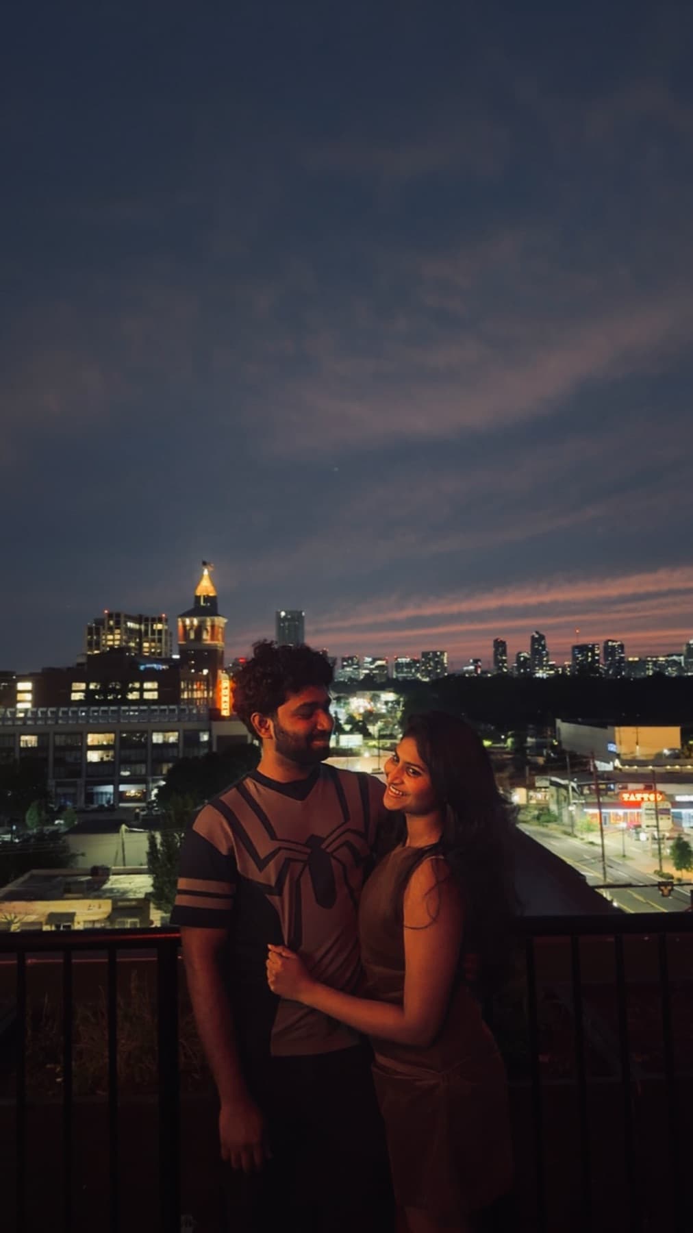 Tejesh & Madhu Padisetti against the evening skyline