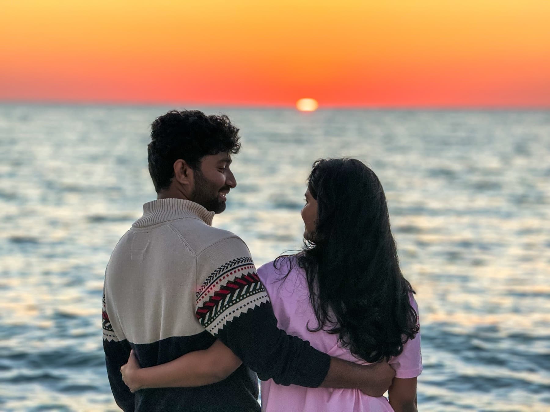 Tejesh & Madhu Padisetti watching the sunset by the sea